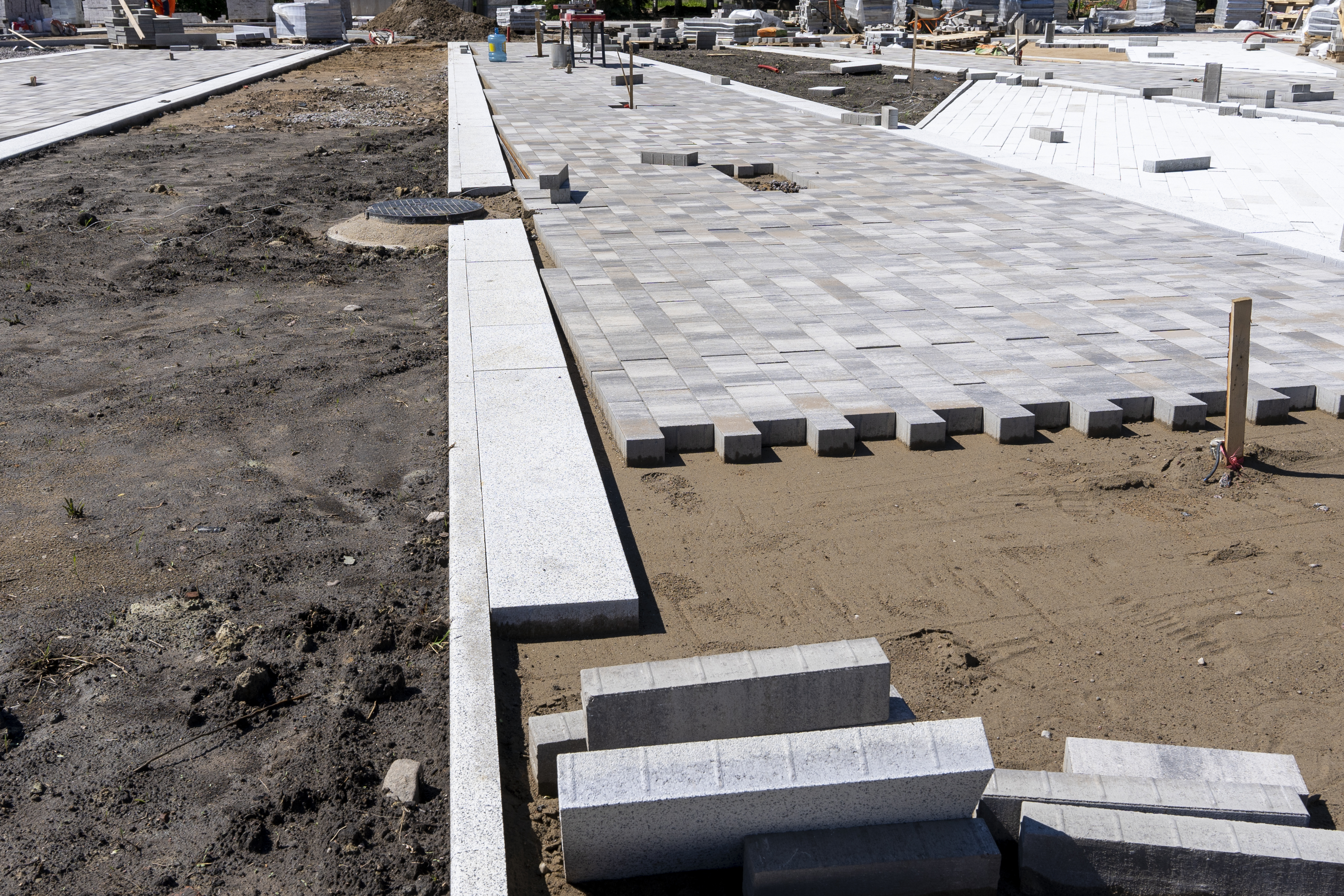 Commercial paver plaza installation by Apex Contractors